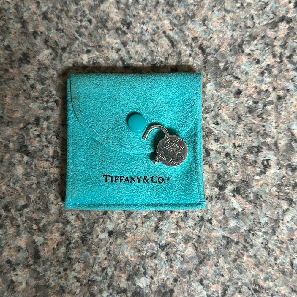 Tiffany & Co round padlock with pouch. Like new.